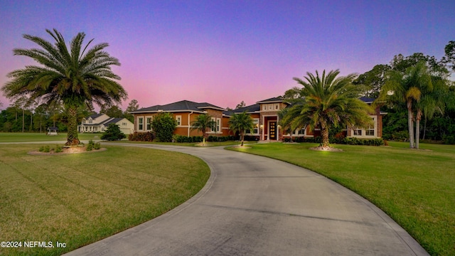 view of front of property with a lawn