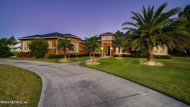 view of front of house with a yard