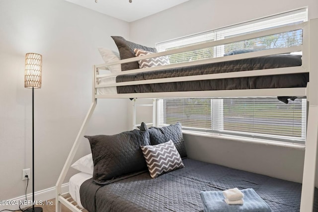 bedroom featuring multiple windows