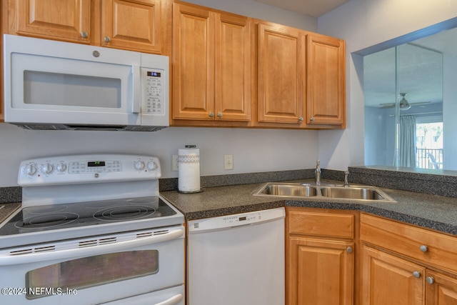 kitchen featuring white appliances, ceiling fan, and sink