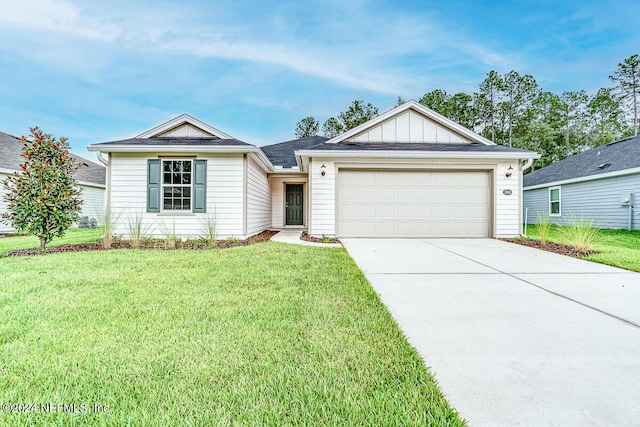 single story home featuring a garage and a front yard