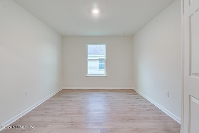 unfurnished room featuring light hardwood / wood-style flooring