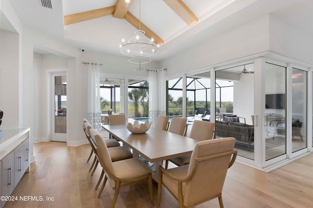 dining area featuring a notable chandelier, vaulted ceiling with beams, and light wood-type flooring