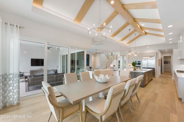 dining area featuring beamed ceiling, high vaulted ceiling, a notable chandelier, sink, and light hardwood / wood-style flooring