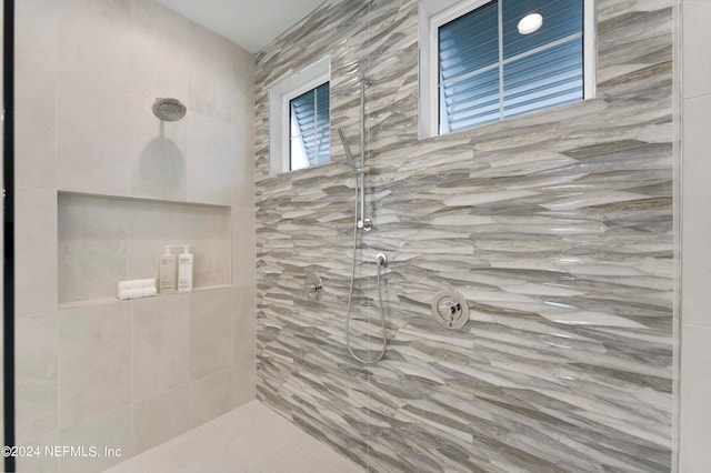 bathroom with tiled shower