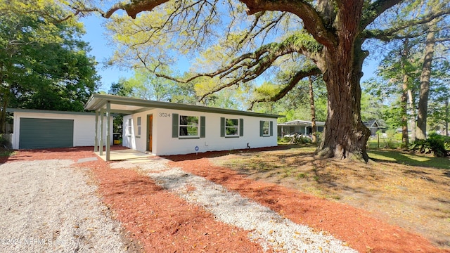 ranch-style house featuring a garage