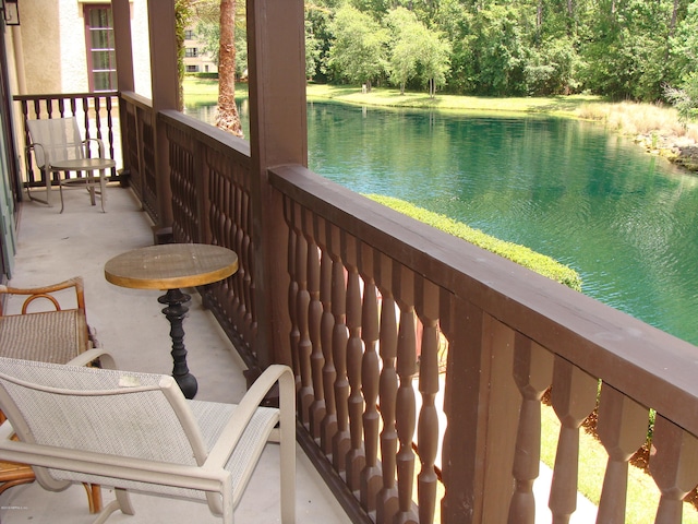 balcony featuring a water view