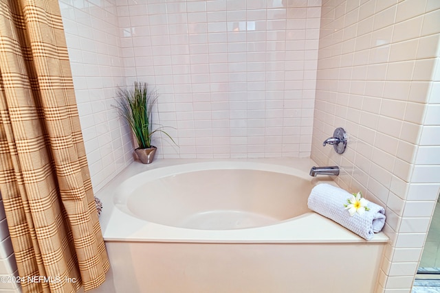 bathroom with shower / bathtub combination with curtain