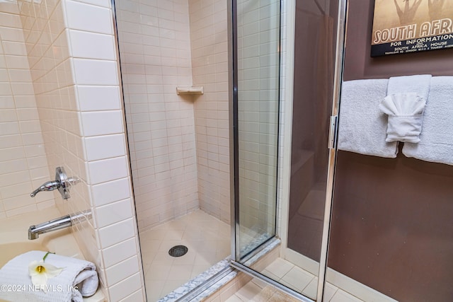 bathroom featuring walk in shower