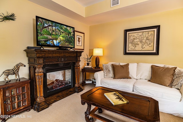 carpeted living room featuring a multi sided fireplace