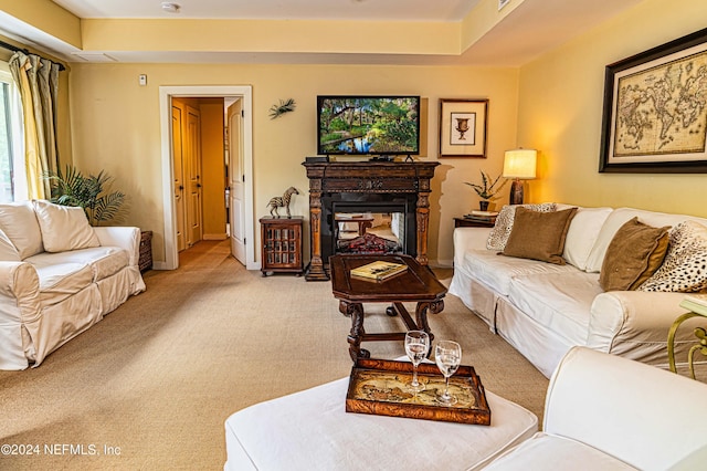 living room with light carpet and a multi sided fireplace