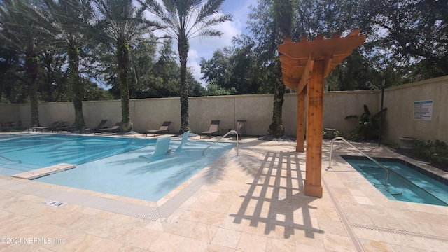 view of swimming pool featuring a patio