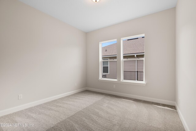 unfurnished room with carpet floors