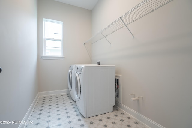 washroom with independent washer and dryer