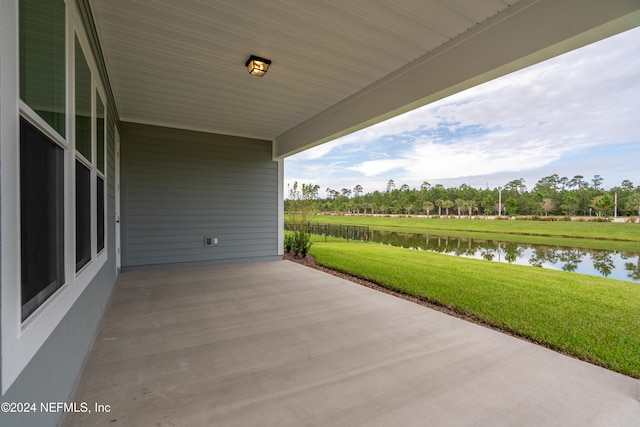 view of patio with a water view