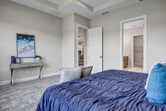 bedroom featuring carpet and ensuite bath