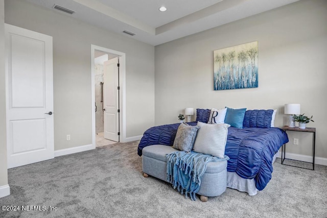 carpeted bedroom with ensuite bathroom