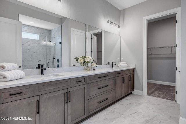 bathroom featuring vanity and a shower with door