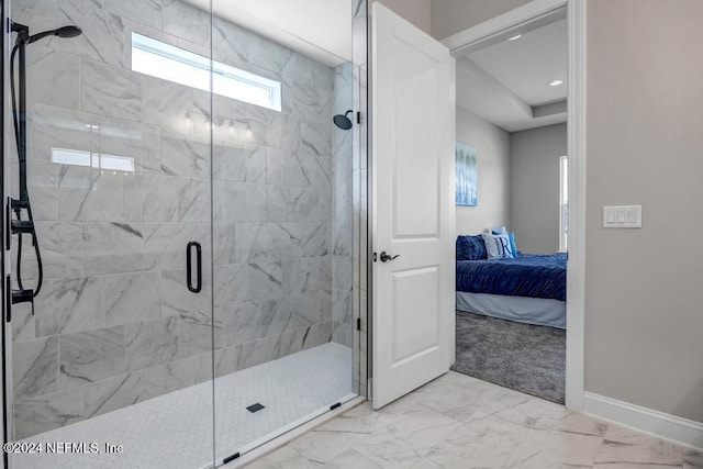 bathroom featuring a shower with shower door