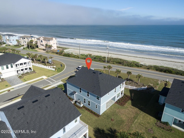 drone / aerial view with a beach view and a water view