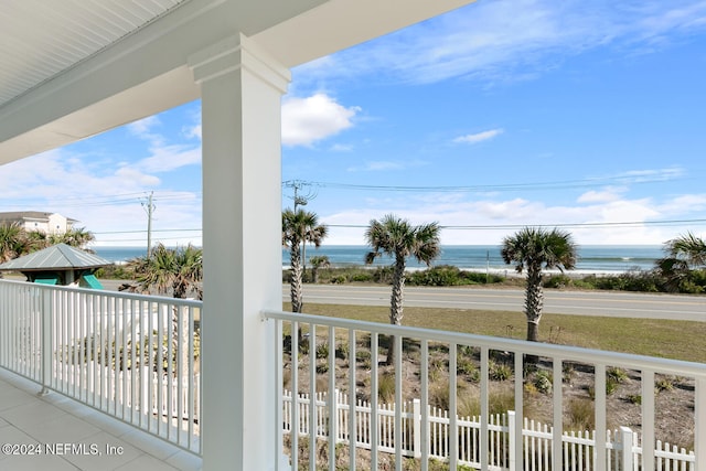 balcony featuring a water view