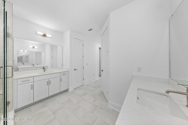 bathroom featuring vanity and walk in shower