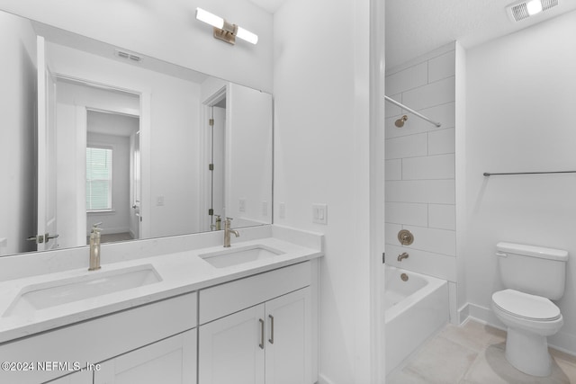 full bathroom featuring tile patterned flooring, vanity, toilet, and shower / washtub combination