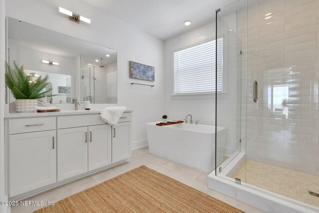 25 Seaside Vista Ct, Saint Augustine, FL 32084 - full bath with a shower stall, a soaking tub, vanity, and tile patterned flooring