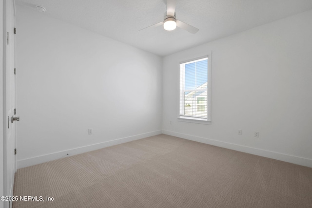 25 Seaside Vista Ct, Saint Augustine, FL 32084 - empty room featuring light carpet, baseboards, and ceiling fan