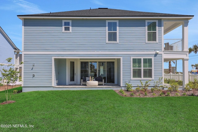 25 Seaside Vista Ct, Saint Augustine, FL 32084 - back of property featuring a patio, a lawn, and a balcony