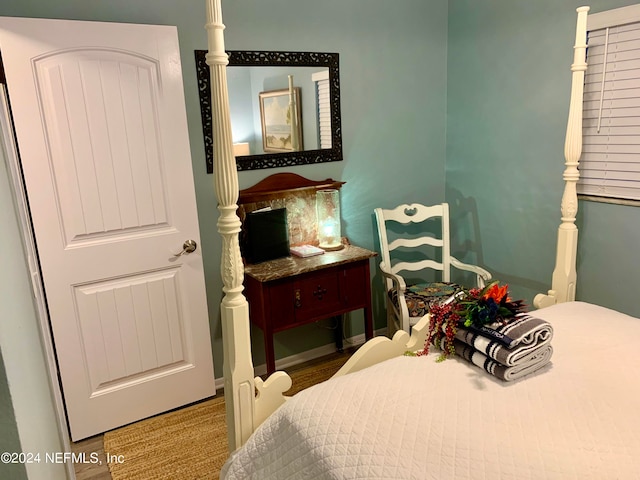 bedroom with wood-type flooring