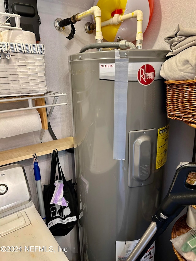 utility room featuring electric water heater