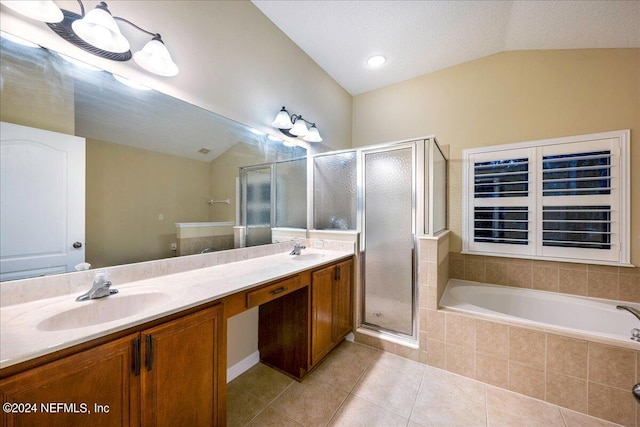 bathroom featuring a textured ceiling, separate shower and tub, tile patterned floors, lofted ceiling, and vanity