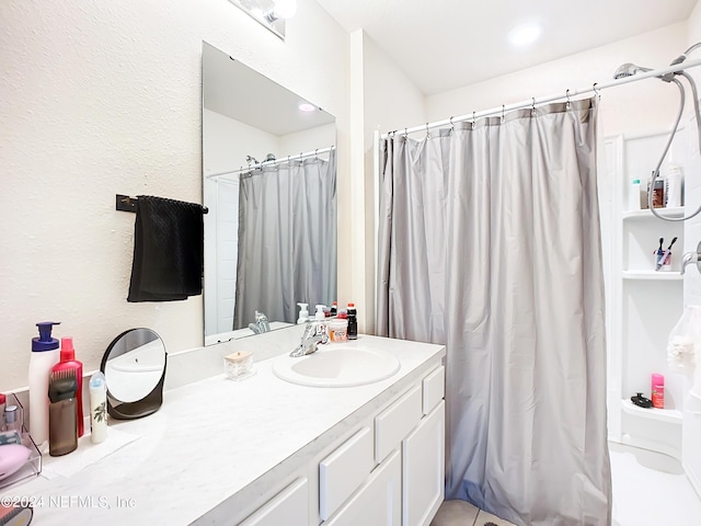 bathroom featuring vanity and walk in shower