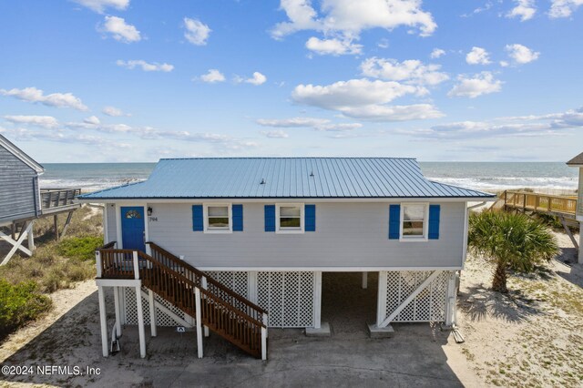 back of house with a water view