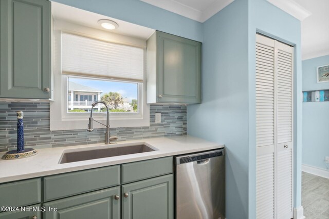 kitchen featuring sink, backsplash, stainless steel dishwasher, and light wood-type flooring