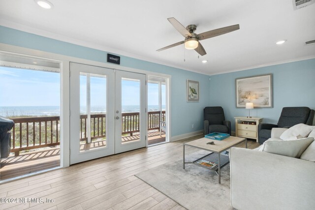 living room featuring french doors, plenty of natural light, light hardwood / wood-style floors, and ceiling fan