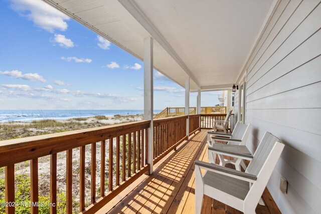 balcony featuring a water view