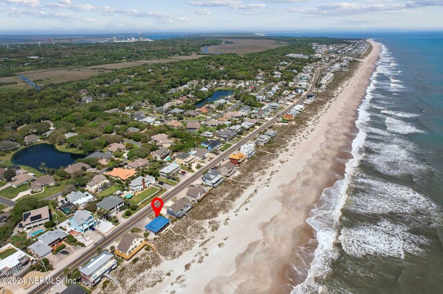 drone / aerial view with a view of the beach and a water view