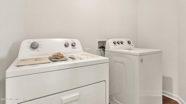 laundry room featuring independent washer and dryer and dark hardwood / wood-style floors