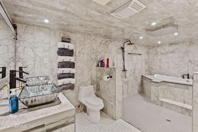 full bathroom with tile walls, independent shower and bath, tile floors, and toilet