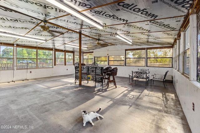 sunroom / solarium featuring lofted ceiling