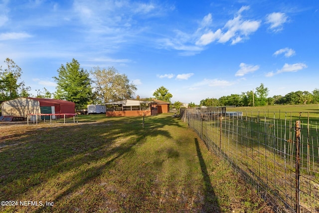 view of yard with a rural view