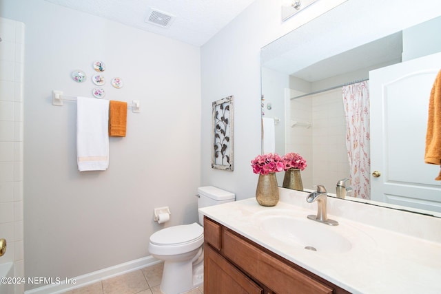 bathroom featuring a textured ceiling, vanity, walk in shower, toilet, and tile patterned floors