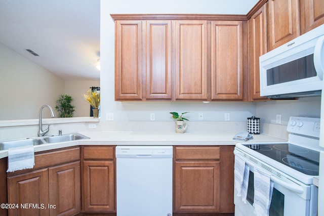 kitchen with white appliances and sink