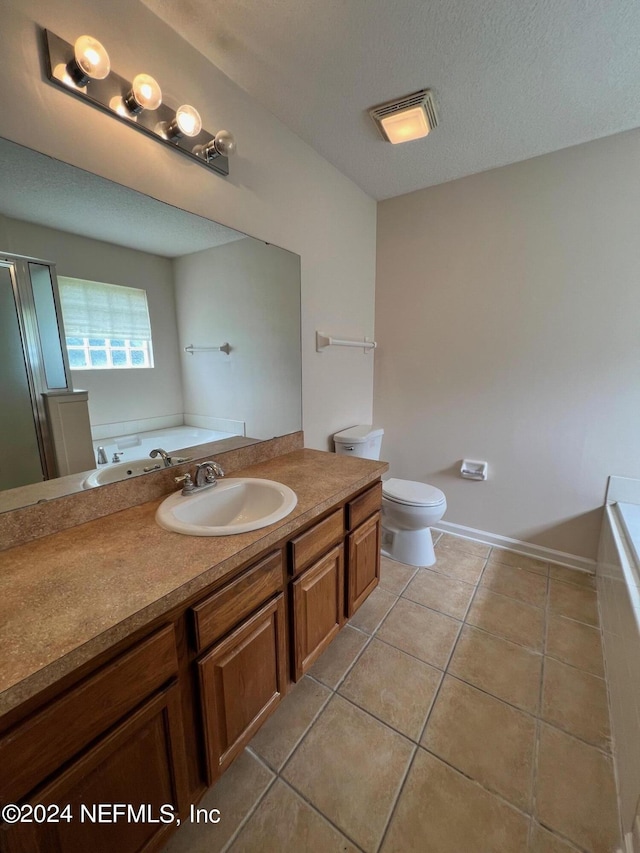 1450 Elsa Dr, Jacksonville, FL 32218 - bathroom with tile patterned flooring, toilet, baseboards, and a garden tub