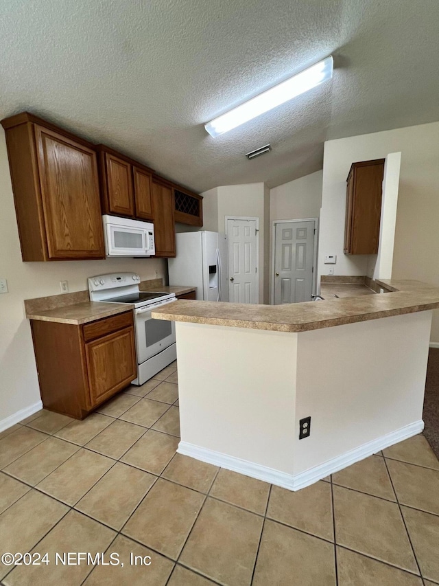 1450 Elsa Dr, Jacksonville, FL 32218 - kitchen with light tile patterned floors, a peninsula, brown cabinets, and white appliances