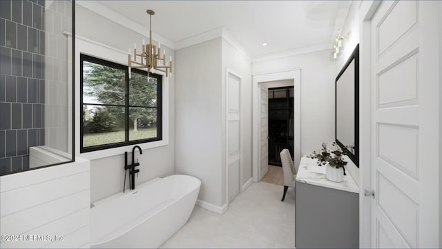 bathroom with a washtub, vanity, an inviting chandelier, and crown molding