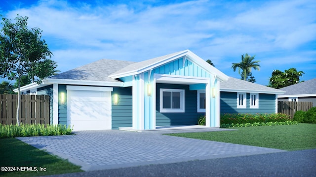 view of front of house featuring a garage and a front yard