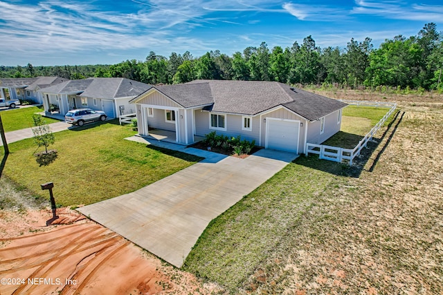 single story home with a front lawn and a garage